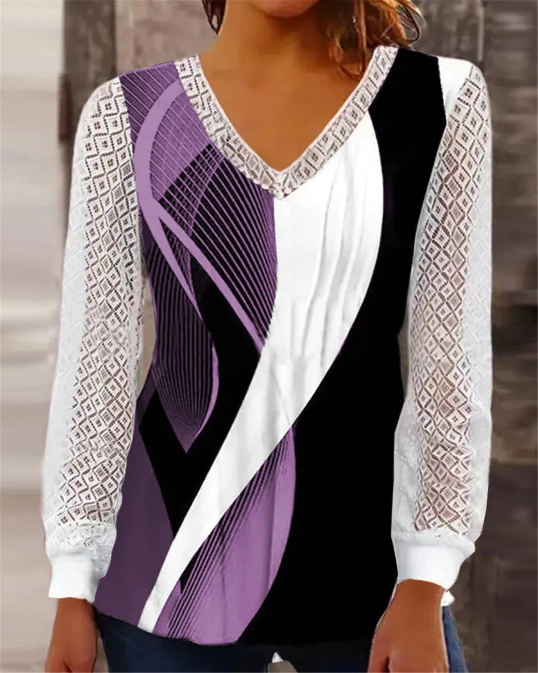 Purple v-neck loose lace top with hollow-out pattern and long sleeves on hanger