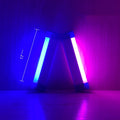 Rechargeable dimmable LED tube light in blue and purple colours shown in a bedroom setting.