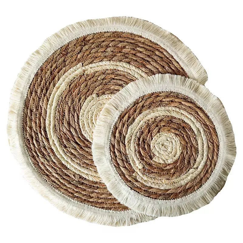 Round papyrus straw placemat with decorative tassels in modern solid colour design