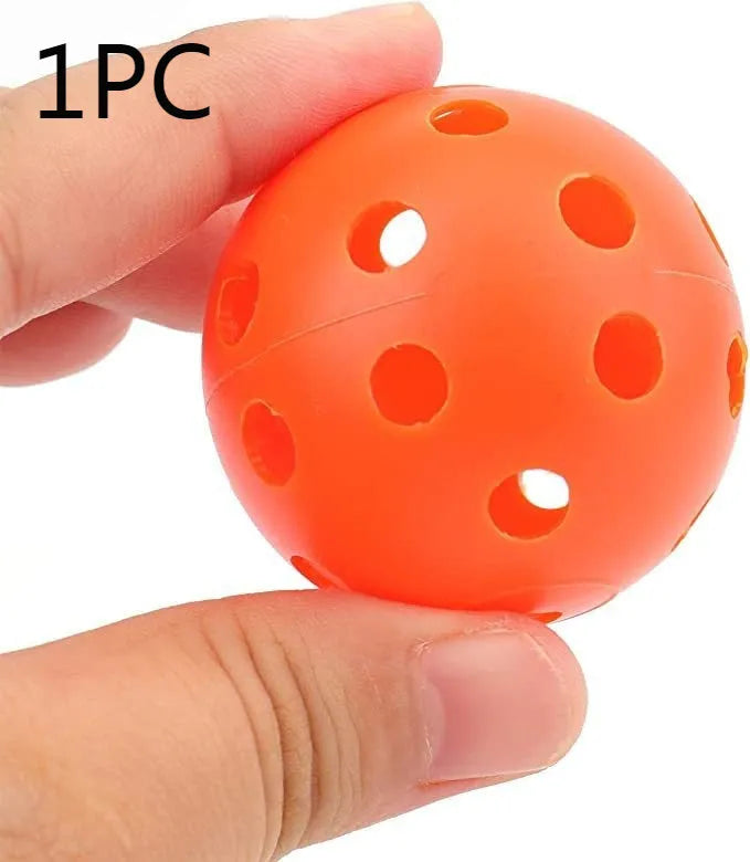 Six multi-colour 42mm golf practice balls in red, orange, blue, green, white, and yellow in a net.