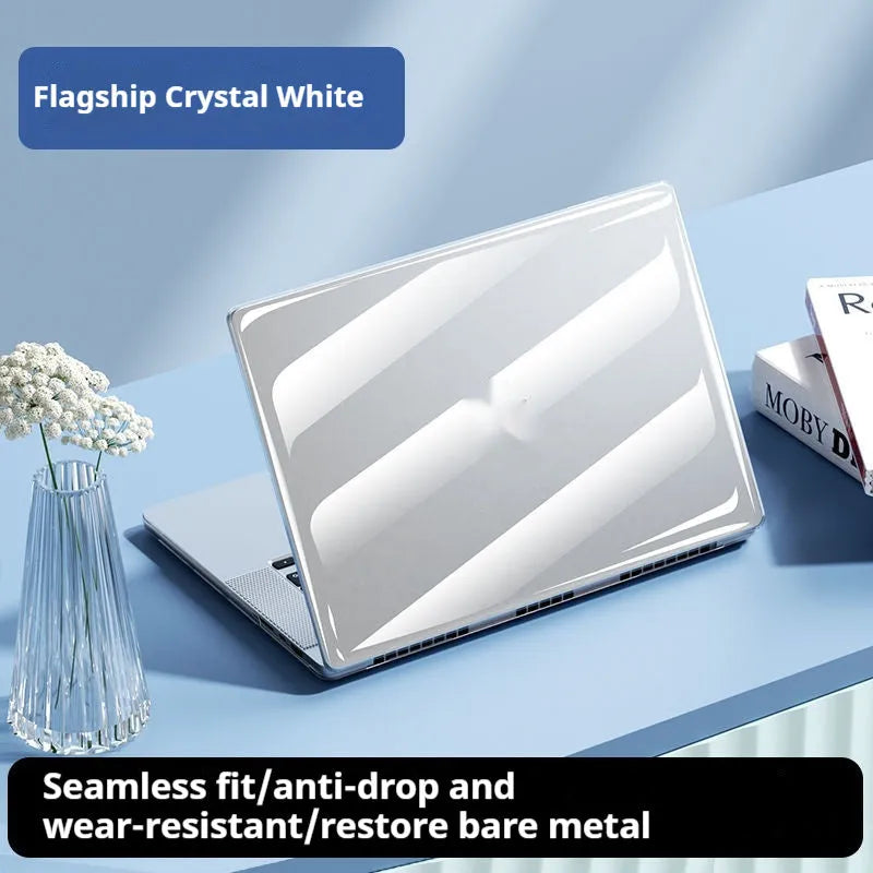 Transparent plastic hard shell protective case for a MacBook laptop on a table.