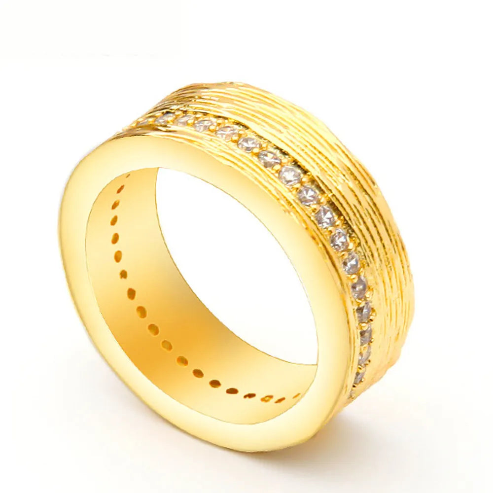 Geometric gold-coloured zircon ring for women, shown in size 7.