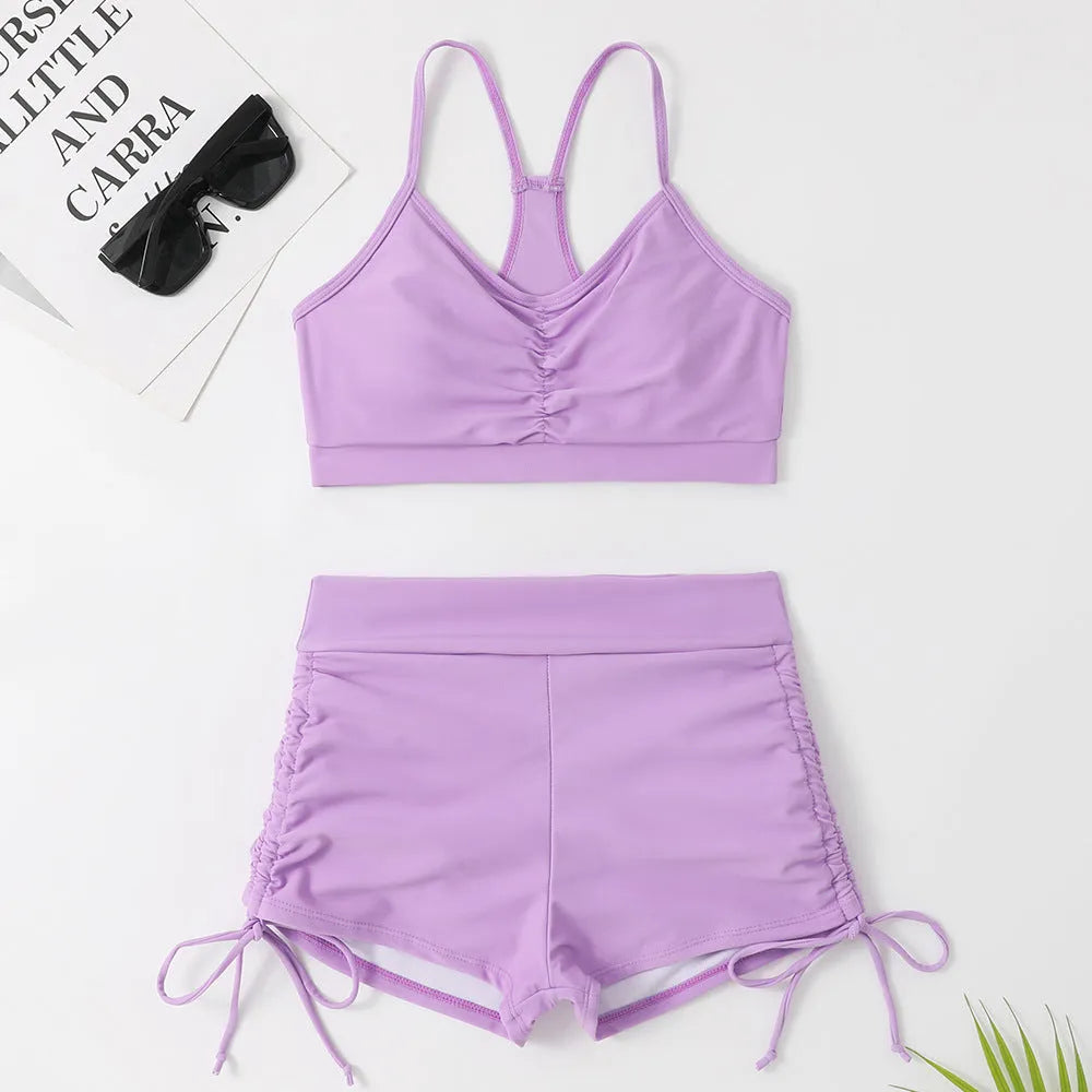 Women's high waist split swimsuit bikini in black or purple colour with briefs styling