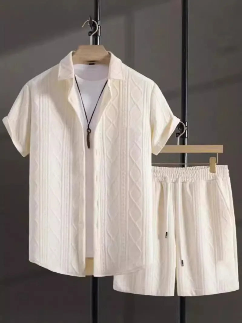 Man wearing black and white jacquard print short sleeve suit with shirt-style jacket and matching shorts