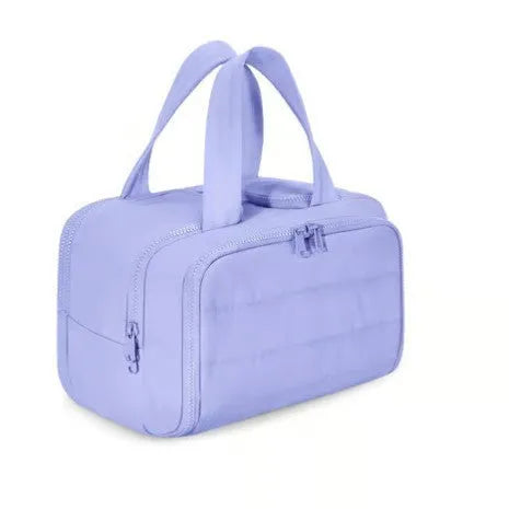 Large fluffy travel toiletry bag with wide open top, shown in a choice of colours.