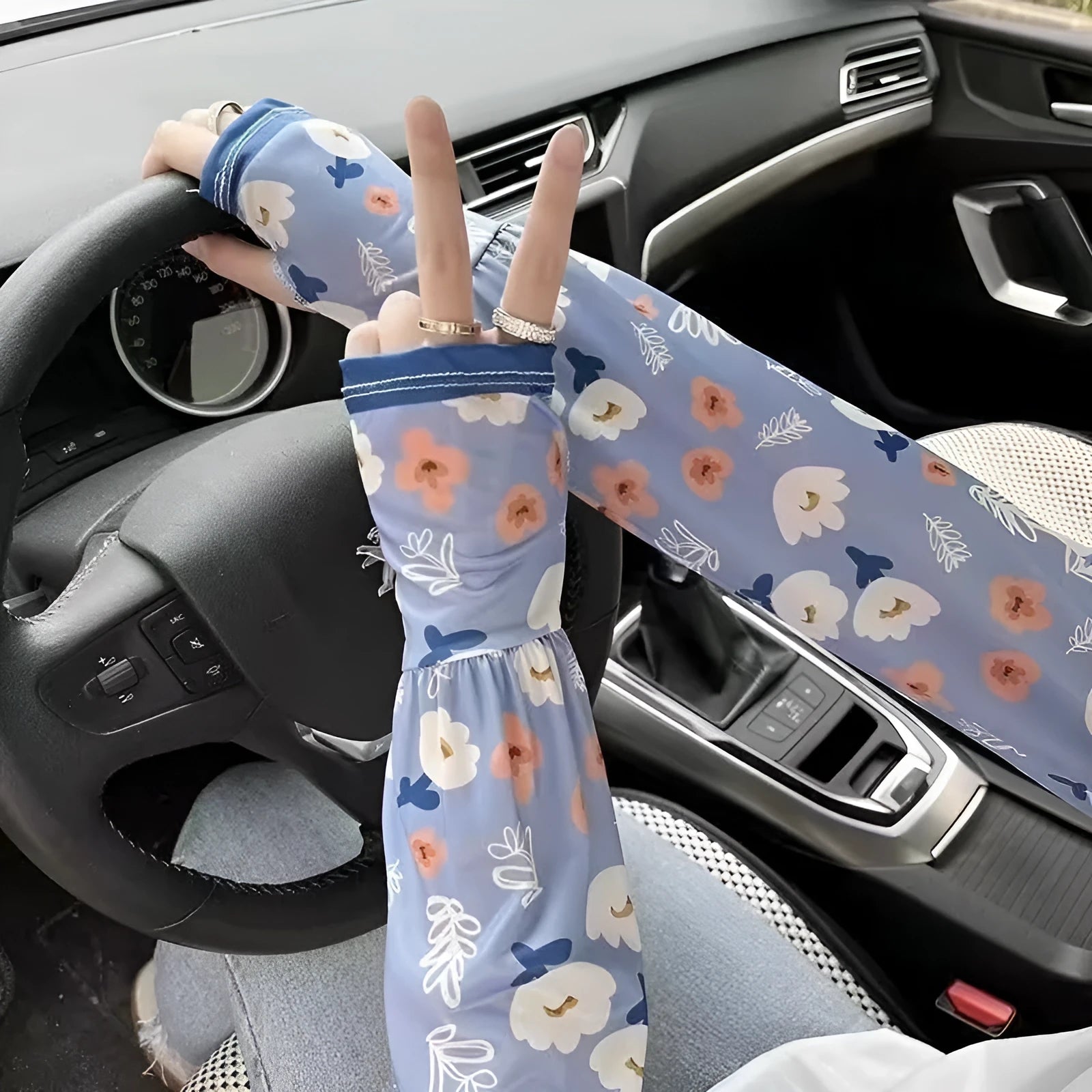 A pair of printed viscose ice silk sun protection sleeve gloves covering the forearm and elbow.