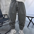 Men's loose-fit cropped sports trousers in bamboo fibre, shown in Army Green colour.