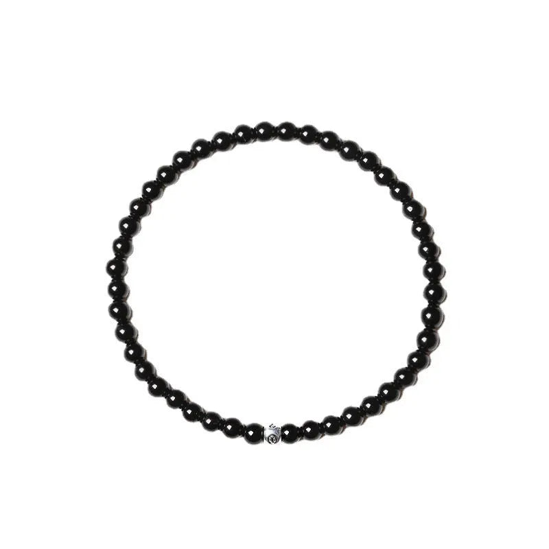 Fine geometric agate bracelet with round and square 4mm beads in obsidian, blue san, and black agate colours.