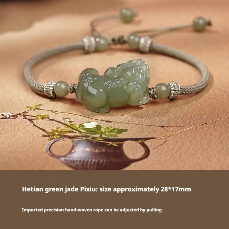 Hetian Jade bracelet with a black and red braided rope band and a central jade bead.