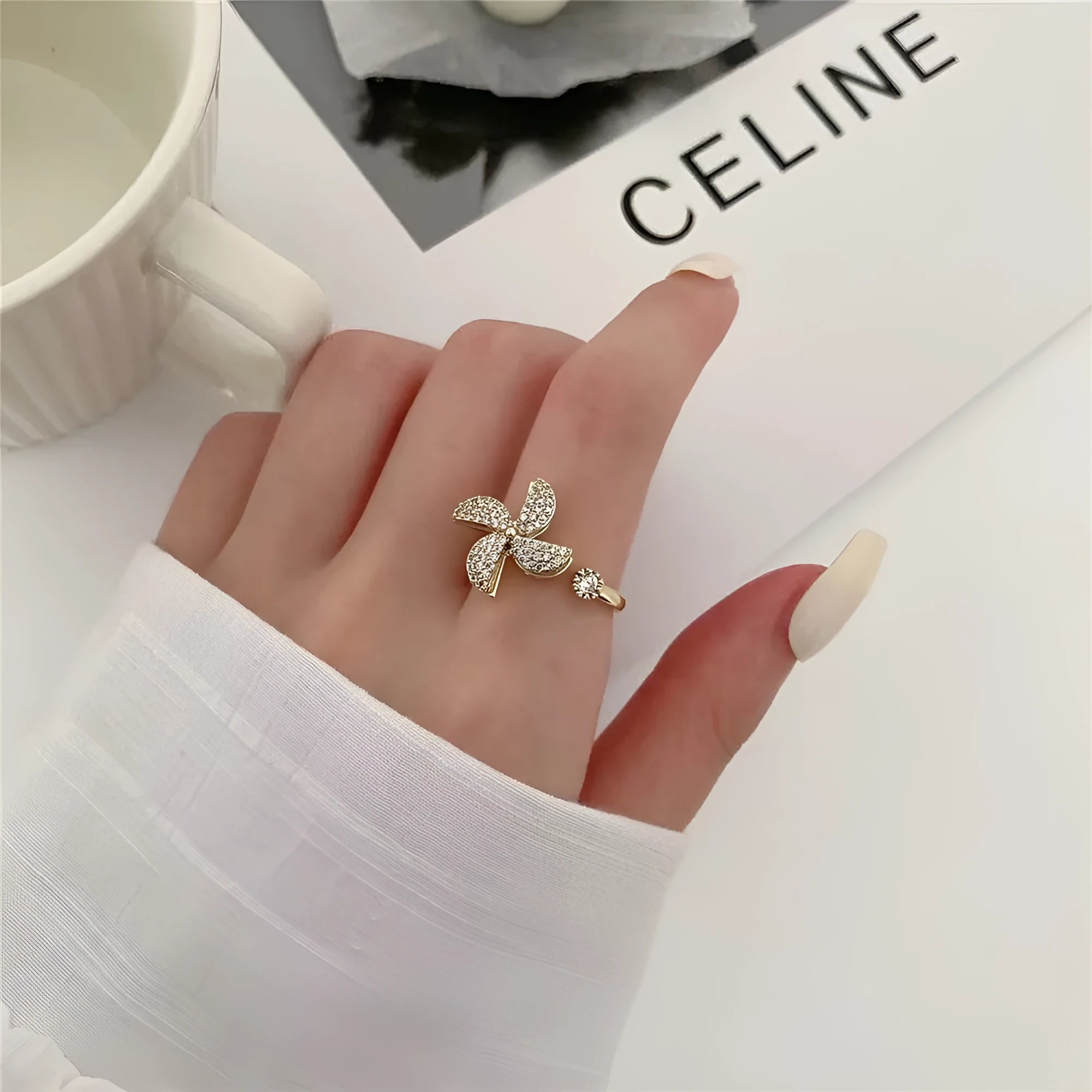 Rotating windmill ring with micro-inlaid design in gold or silver electroplated finish
