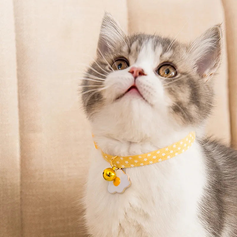 Adjustable cat collar with bell pendant and bow tie accessory for small pets