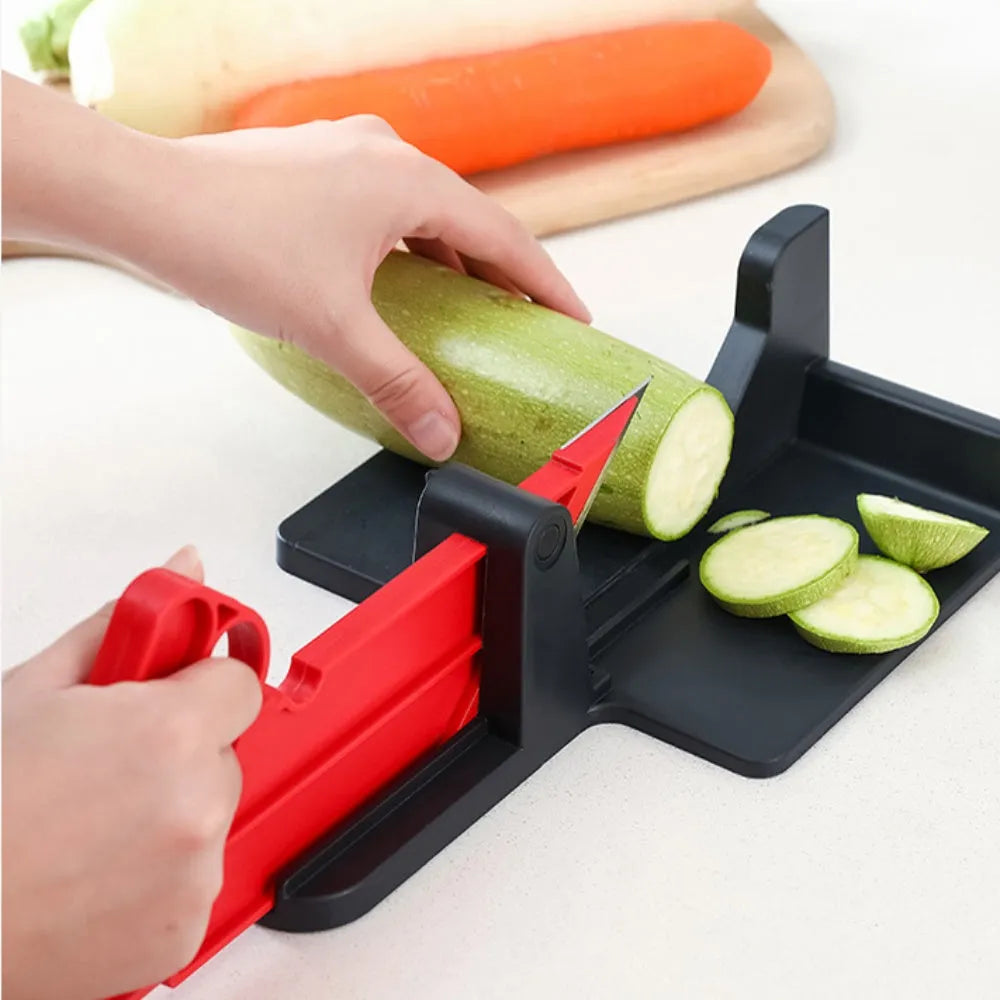 Green and red modern vegetable cutting tool for carrots and potatoes on a kitchen counter