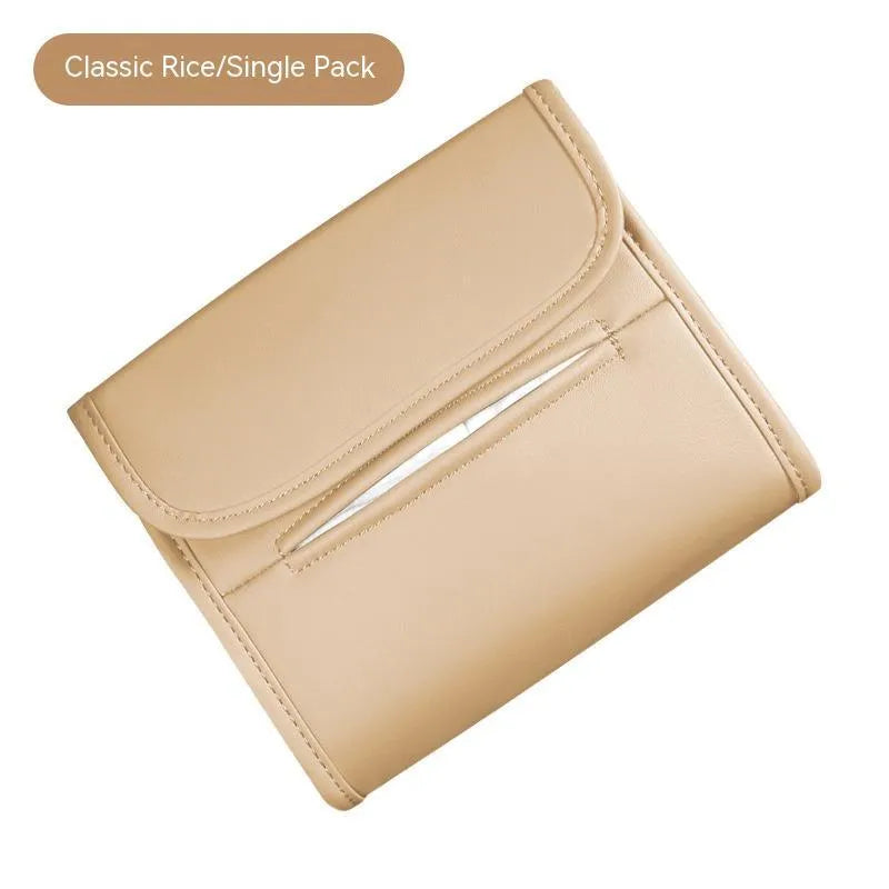 Leather car tissue box mounted on a car sun visor with elastic band strap.