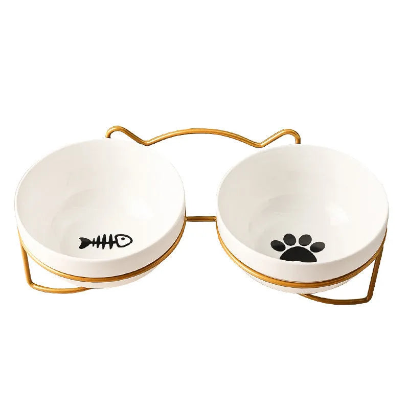 White ceramic pet bowl with cat paw print pattern in black iron frame stand