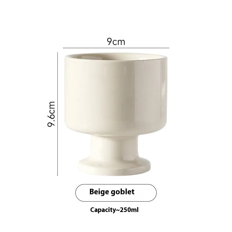 Hand-pinched irregular ceramic mug in solid colour with modern simple style, shown from side angle