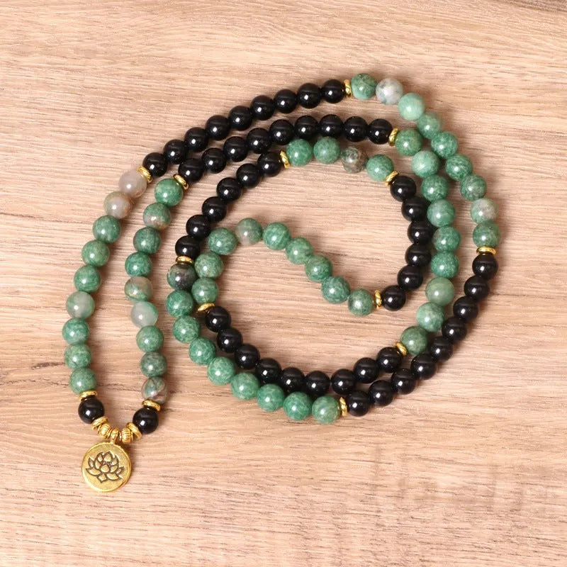 Green and black alloy beaded elastic bracelet with stretch band on wrist