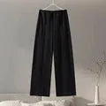 Women's black polar fleece suit set with O-neck top and wide leg trousers