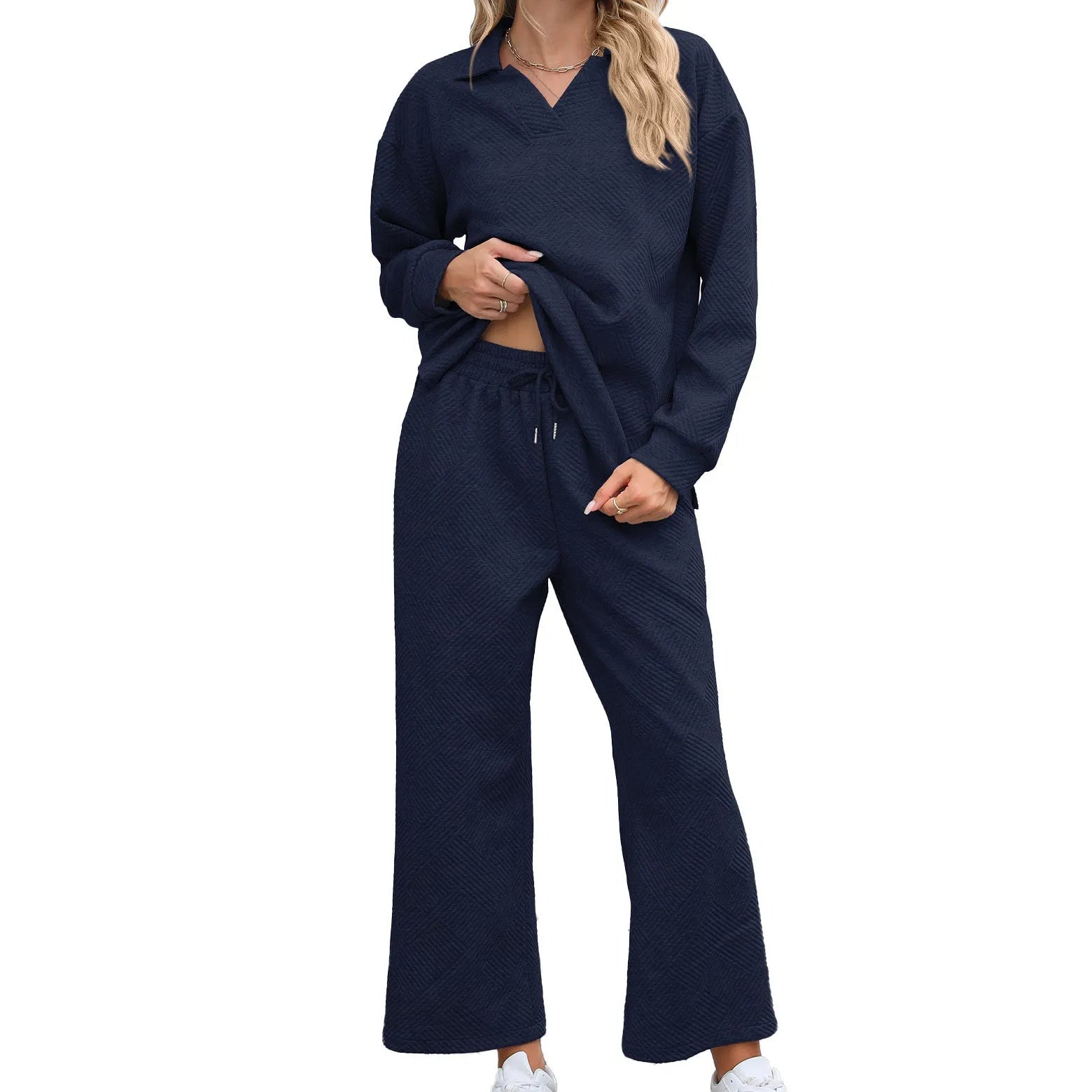 Women's solid colour lapel long sleeve knit jumpsuit with elastic waist trousers in jacquard fabric.