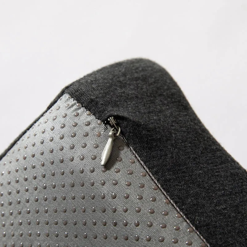 A solid grey memory foam office chair cushion for lumbar support.