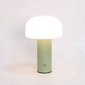 USB-powered dual-purpose table lamp providing atmospheric lighting and charging in black, green, orange, or white
