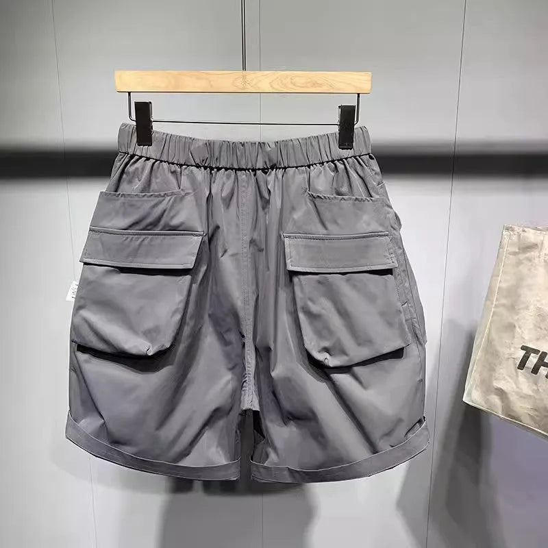 Men's large size work shorts with pockets in black or grey with loose fit design