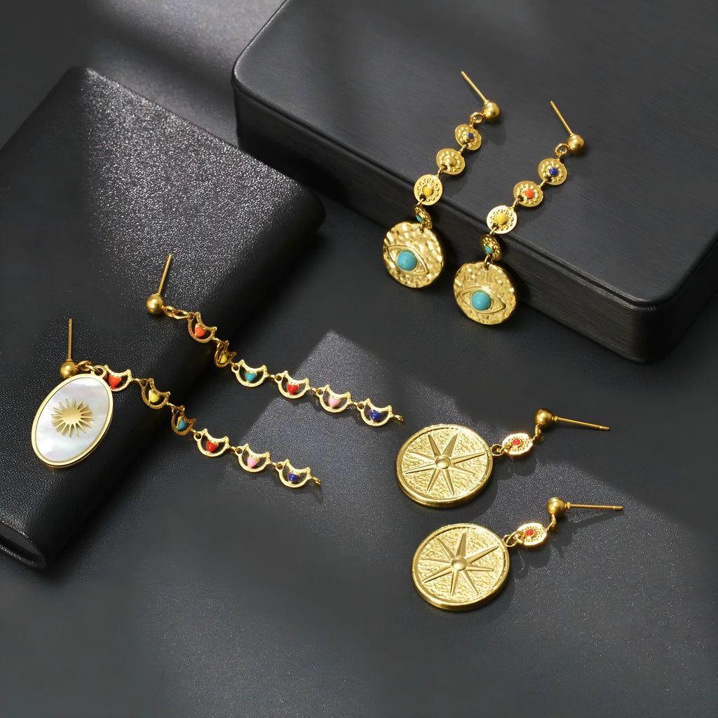 Geometric stainless steel statement earrings showing star, eye, and sun design options.
