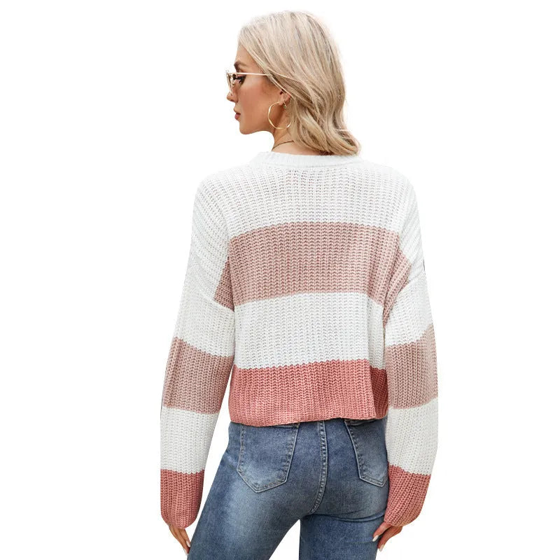 Women's pink and dark blue striped loose pullover with short length on hanger