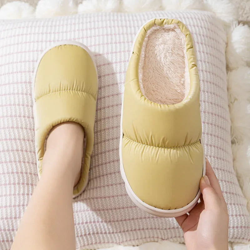 Down cotton indoor slippers with artificial leather upper and rubber sole in various colours
