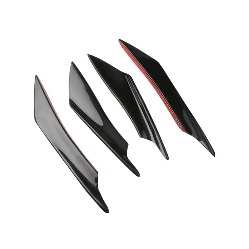 Set of four carbon fibre effect ABS plastic bumper air knife spoilers for car styling.