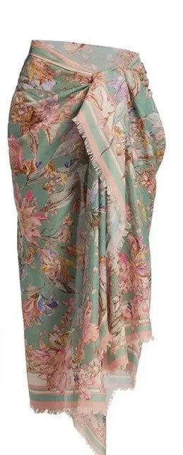 Women's creamy white floral bikini set with skirt cover-up on beach