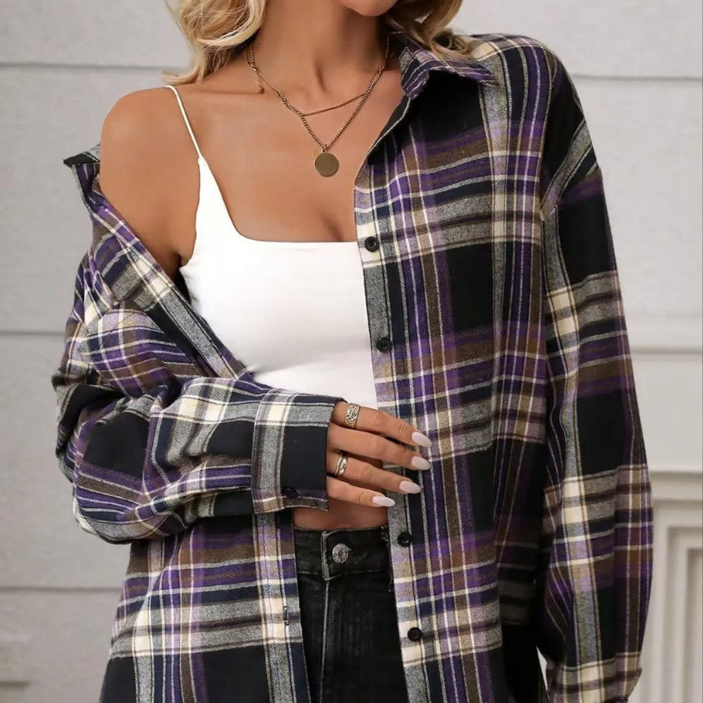 Women's loose fit black plaid long sleeve cotton shirt on a hanger.