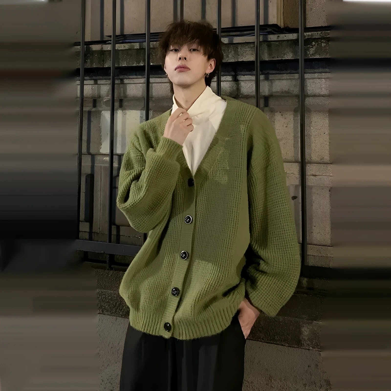 Men's loose-fit V-neck cotton blend cardigan sweater in army green, shown on a hanger.