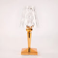 Rose gold plated acrylic portable touch night light with projection feature and rechargeable base on a wooden table