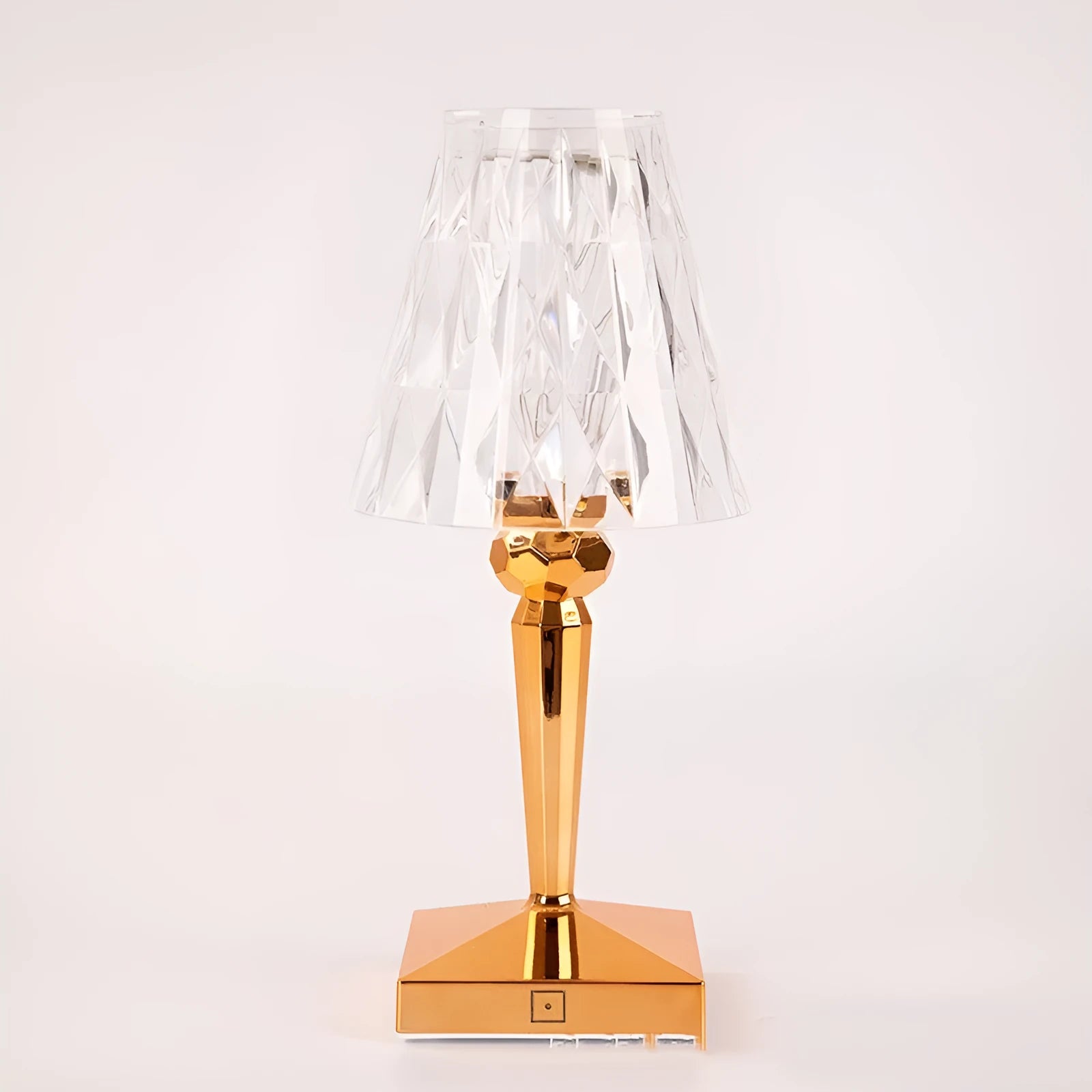 Rose gold plated acrylic portable touch night light with projection feature and rechargeable base on a wooden table