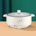 White and green non-stick electric hot pot appliance on a kitchen countertop with multiple size options.
