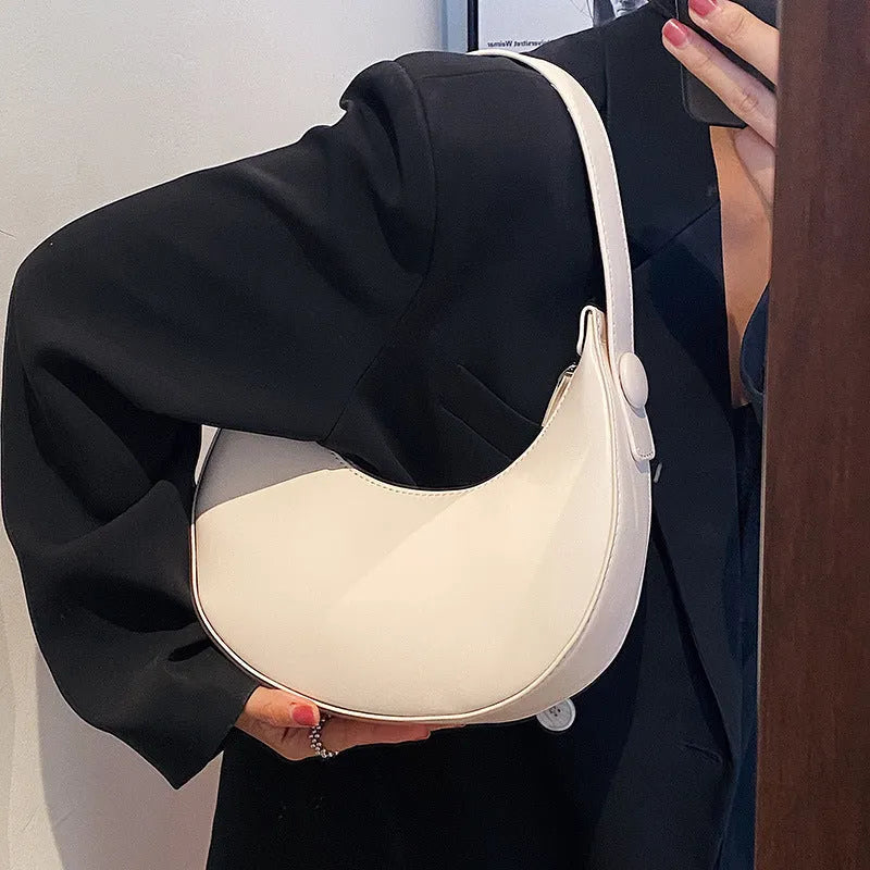 Women's retro dumpling-shaped shoulder bag in PU leather with a sandwich pocket.