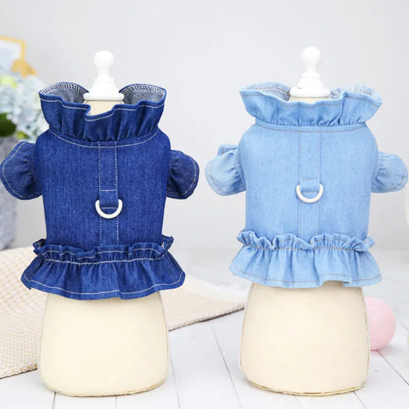 Blue denim pet dress with ruffle trim and leash hook attachments on chest and back
