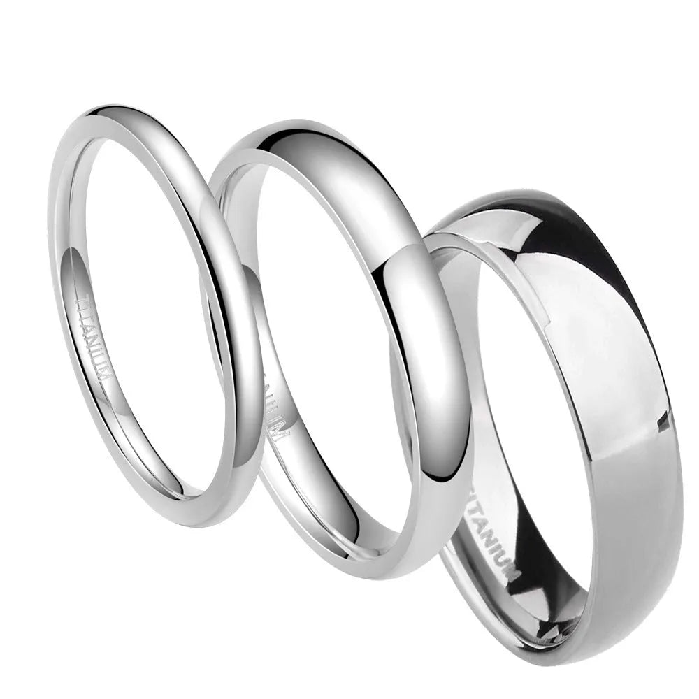 Silver titanium steel unisex ring shown in different band widths on a hand.