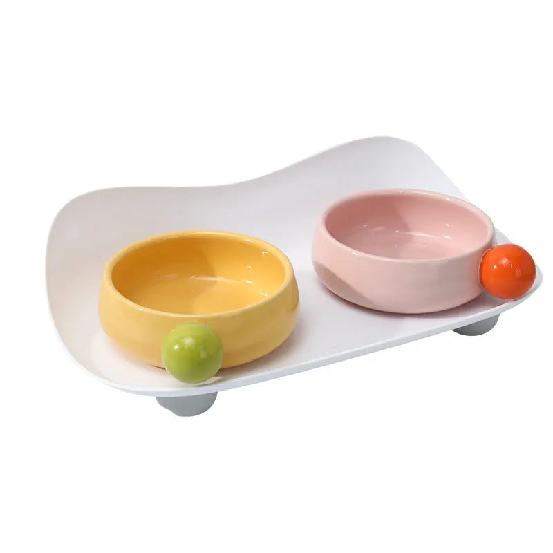 Ceramic elevated pet feeding bowl set with two bowls and non-slip base in pink colour