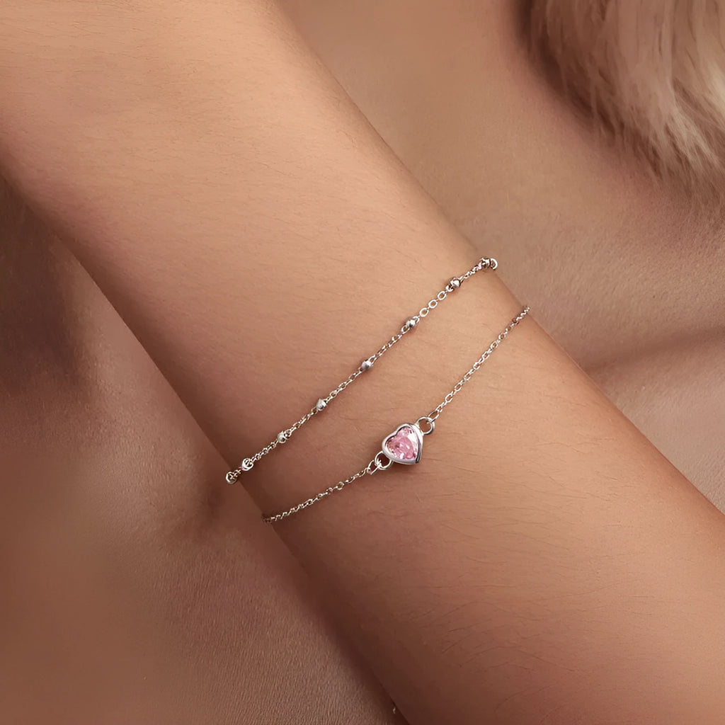 Women's 925 sterling silver bracelet with a small heart charm on an adjustable chain.