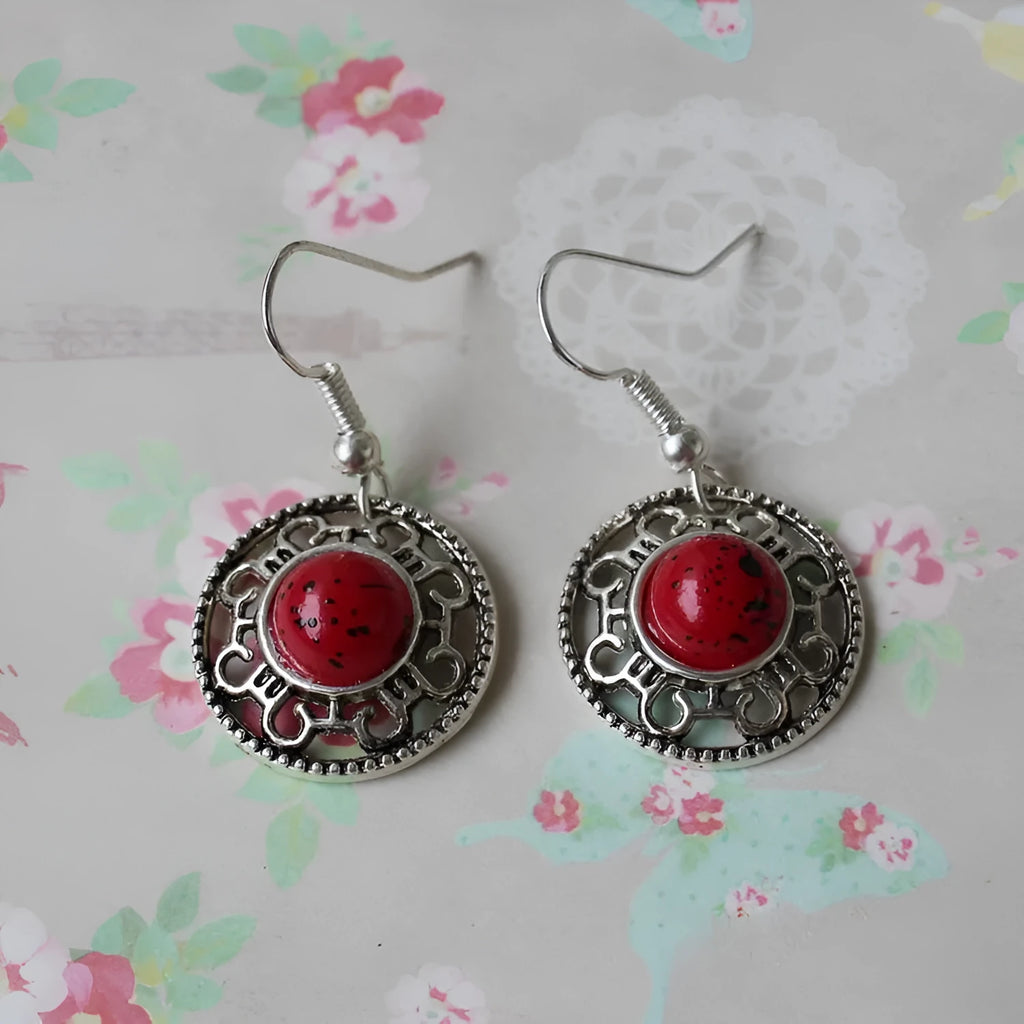 Handmade Miao silver turquoise earrings with geometric flower disk design and ethnic patterns