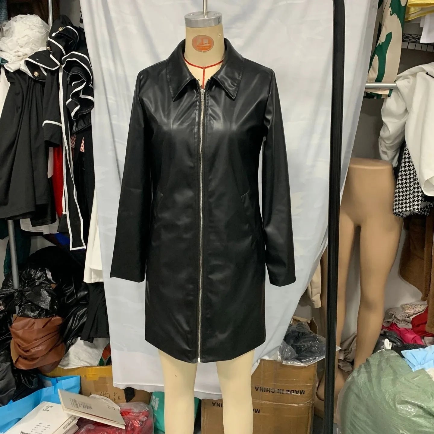Black women's leather jacket with long sleeves and medium 65cm length
