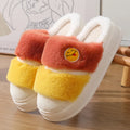 Cartoon-style pink and green thermal plush slippers with cashmere lining.