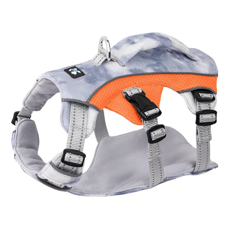 Reflective blue dog cooling vest chest strap harness with quick-release buckle on a grassy background.