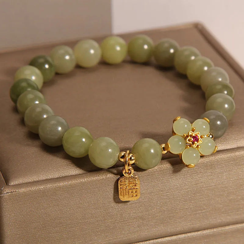 A women's casual alloy bracelet with a grey jade colour finish and a clasp.
