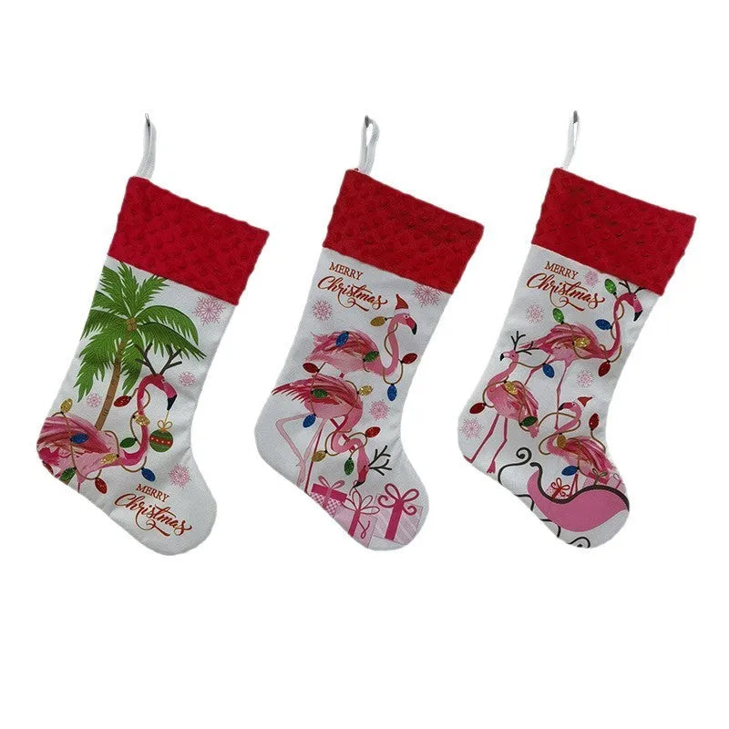 Red and white flamingo print cloth Christmas stocking hanging decoratively.
