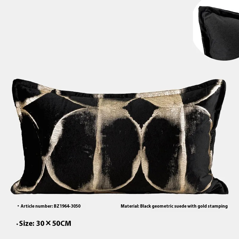 Black and gold abstract patterned decorative cushion on a sofa, available in three sizes with a removable cover.