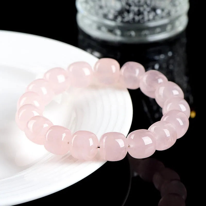 Pink natural crystal barrel bead bracelet with geometric 11mm x 12mm beads.