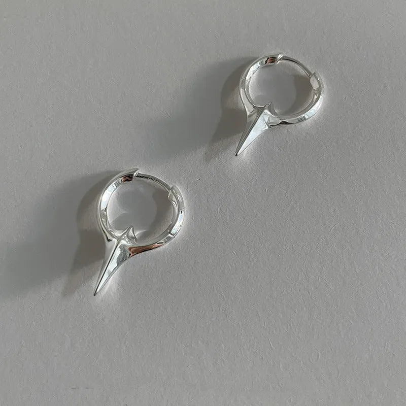 Geometric star shaped ear clips for women with copper construction and platinum electroplated finish
