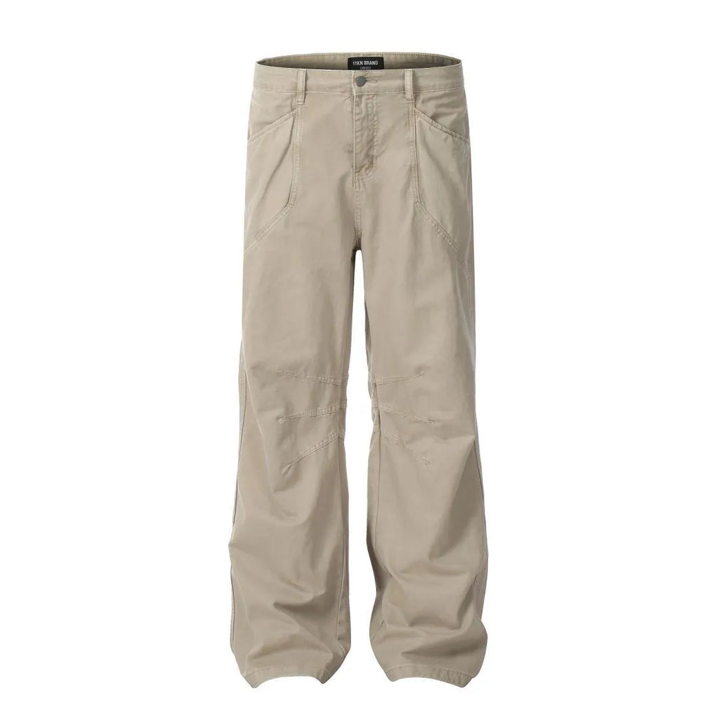 Men's brown loose straight-leg trousers with high waist and wide leg opening on a hanger